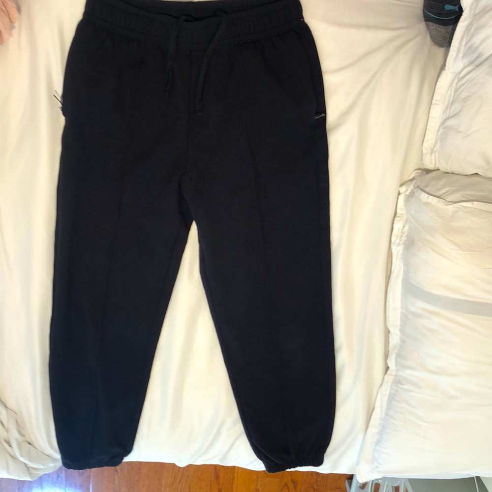 These are black high-rise jogging pants. These have scrunched ankles.